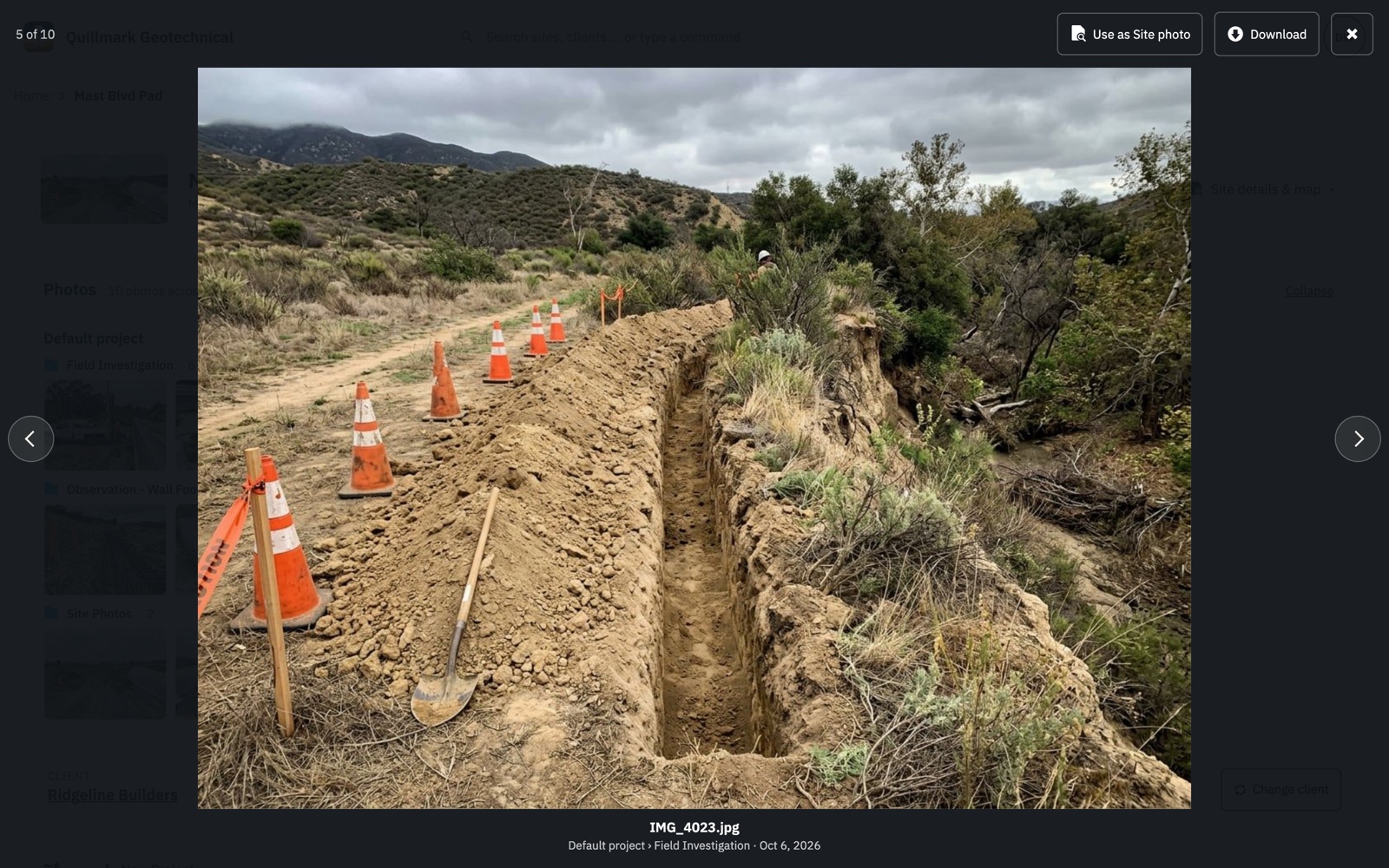 A photo open full size over the Site page: a hand-dug trench along a creek bank lined with traffic cones, “5 of 10” in the corner and the photo’s folder beneath it.